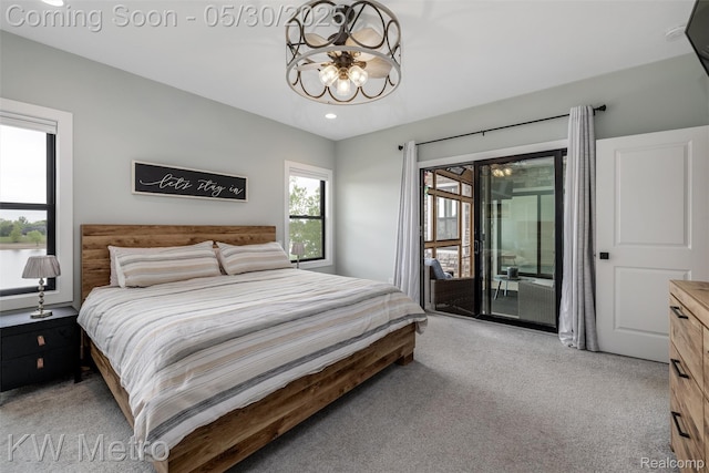 1585 Kriss Crossing Rd, Brighton, MI 48114 - bedroom featuring light colored carpet, a chandelier, access to exterior, and recessed lighting