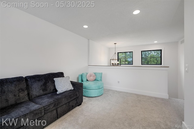 1585 Kriss Crossing Rd, Brighton, MI 48114 - living room with a chandelier, carpet flooring, recessed lighting, and baseboards