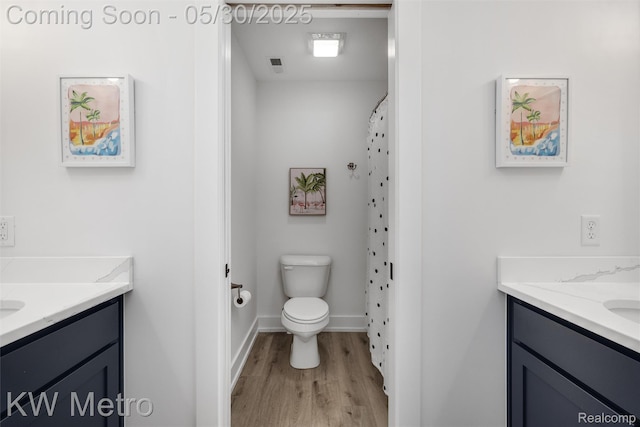 1585 Kriss Crossing Rd, Brighton, MI 48114 - full bath featuring vanity, wood finished floors, toilet, and baseboards