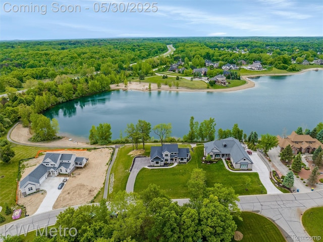 1585 Kriss Crossing Rd, Brighton, MI 48114 - aerial perspective of suburban area with a large body of water and a forest
