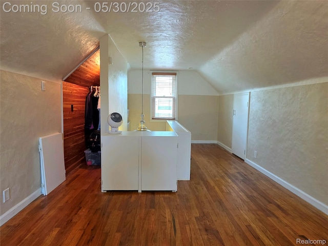 3026 N Blair Ave, Royal Oak, MI 48073 - additional living space featuring a textured ceiling, lofted ceiling, wood finished floors, and baseboards