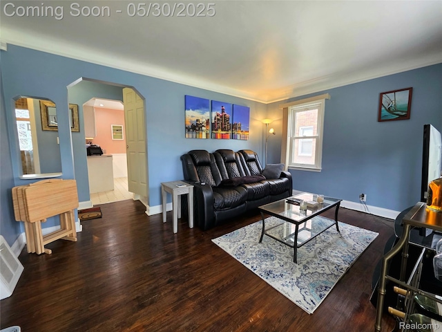 3026 N Blair Ave, Royal Oak, MI 48073 - living area featuring arched walkways, wood finished floors, and baseboards