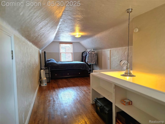 3026 N Blair Ave, Royal Oak, MI 48073 - bedroom with a textured ceiling, vaulted ceiling, wood finished floors, and baseboards
