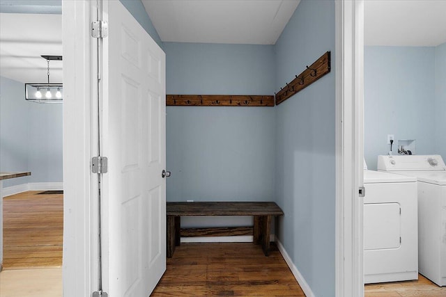 608 Mount Vernon St, Detroit, MI 48202 - laundry area with independent washer and dryer, wood finished floors, and baseboards