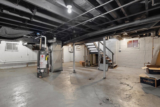 608 Mount Vernon St, Detroit, MI 48202 - unfinished basement with water heater, stairway, and heating unit