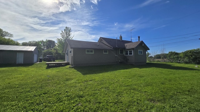1301 US Highway 10, Scottville, MI 49454 - back of house featuring a lawn and a chimney