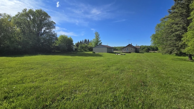 1301 US Highway 10, Scottville, MI 49454 - view of green lawn with an outbuilding and an outdoor structure