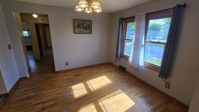 1301 US Highway 10, Scottville, MI 49454 - empty room featuring wood finished floors and baseboards