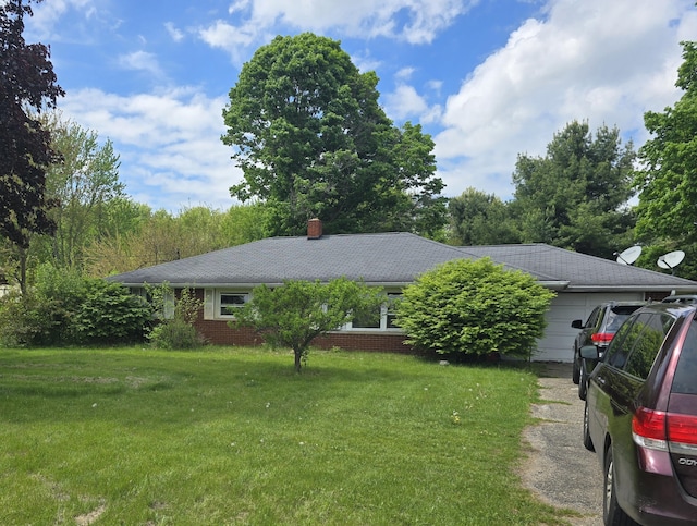 16783 E Augusta Dr, Augusta, MI 49012 - view of front of home with a front lawn, brick siding, and a chimney