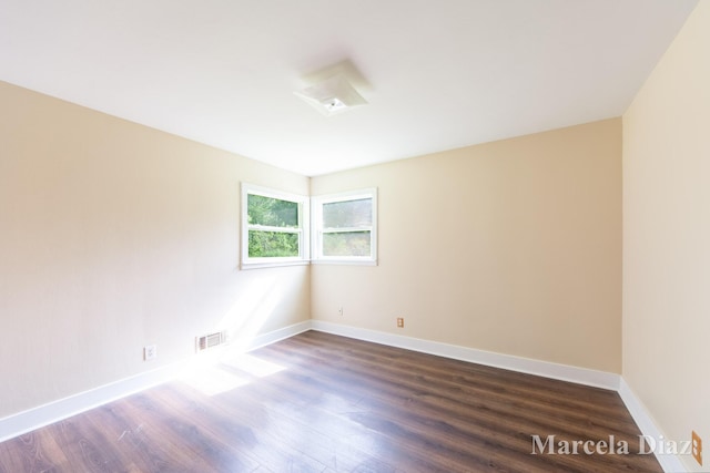 9555 Eastern Ave SE, Byron Center, MI 49315 - spare room with wood finished floors and baseboards