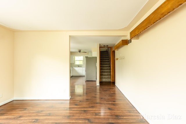 9555 Eastern Ave SE, Byron Center, MI 49315 - empty room with stairway, wood finished floors, ceiling fan, and baseboards