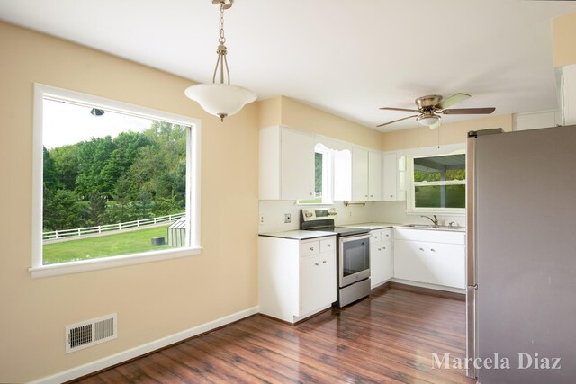 9555 Eastern Ave SE, Byron Center, MI 49315 - kitchen with appliances with stainless steel finishes, a sink, plenty of natural light, and a ceiling fan