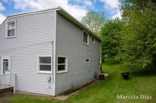 9555 Eastern Ave SE, Byron Center, MI 49315 - view of side of home featuring a yard and cooling unit