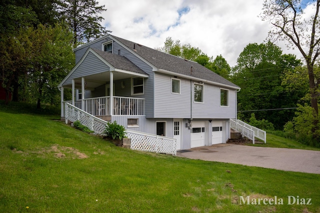 9555 Eastern Ave SE, Byron Center, MI 49315 - rear view of property featuring covered porch, a garage, driveway, stairs, and a yard