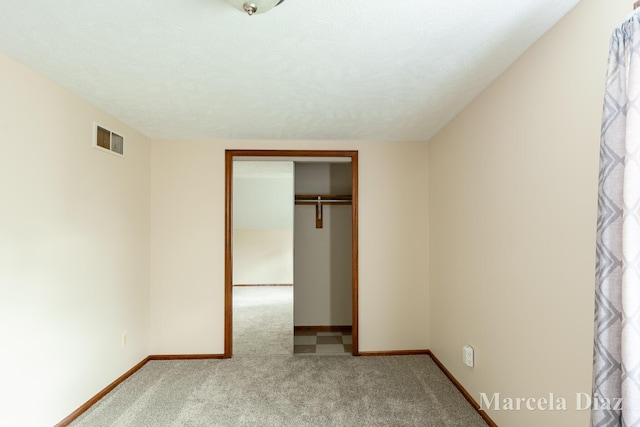9555 Eastern Ave SE, Byron Center, MI 49315 - unfurnished bedroom featuring carpet flooring, baseboards, and a closet