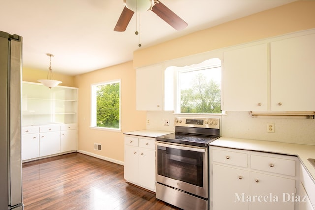 9555 Eastern Ave SE, Byron Center, MI 49315 - kitchen with stainless steel range with electric stovetop, light countertops, dark wood-style flooring, and white cabinetry