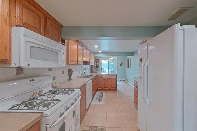 16172 Crest Dr, Linden, MI 48451 - kitchen with white appliances, a sink, light countertops, light tile patterned floors, and recessed lighting