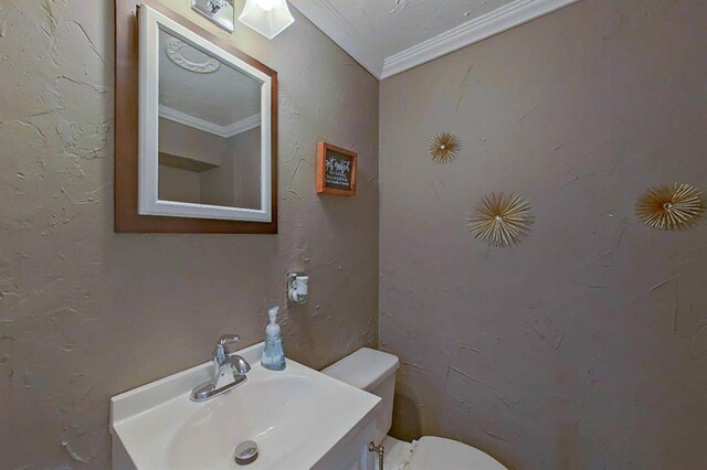 16172 Crest Dr, Linden, MI 48451 - half bathroom featuring toilet, crown molding, and vanity