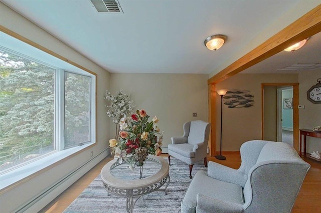 16172 Crest Dr, Linden, MI 48451 - living area featuring a baseboard radiator, plenty of natural light, light wood-type flooring, and baseboard heating