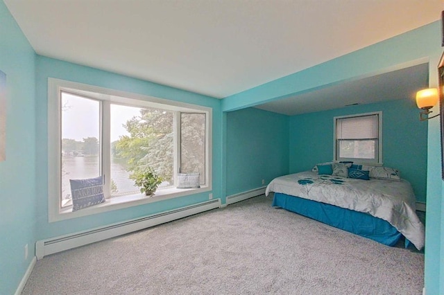 16172 Crest Dr, Linden, MI 48451 - carpeted bedroom with a baseboard heating unit and baseboards