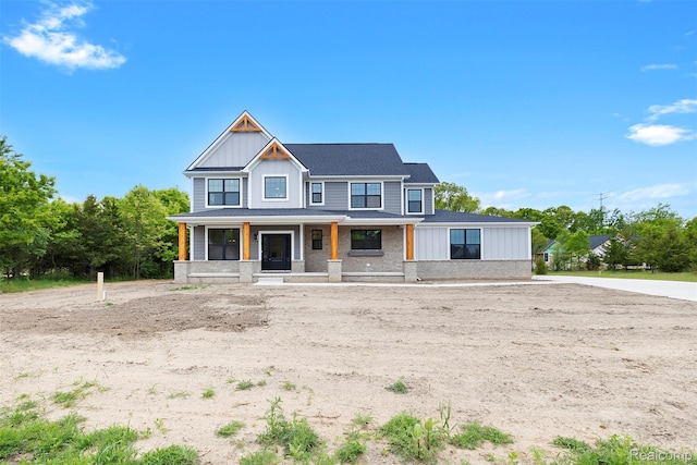 3097 Gecko Trl, Pinckney, MI 48169 - modern farmhouse style home featuring board and batten siding, covered porch, and roof with shingles