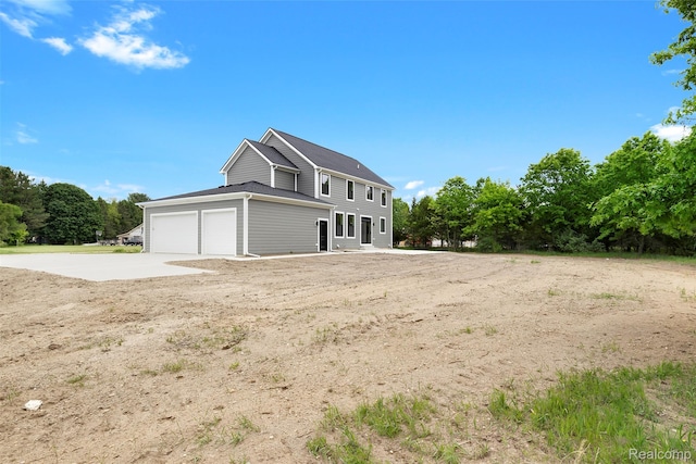 3097 Gecko Trl, Pinckney, MI 48169 - view of property exterior with an attached garage and concrete driveway
