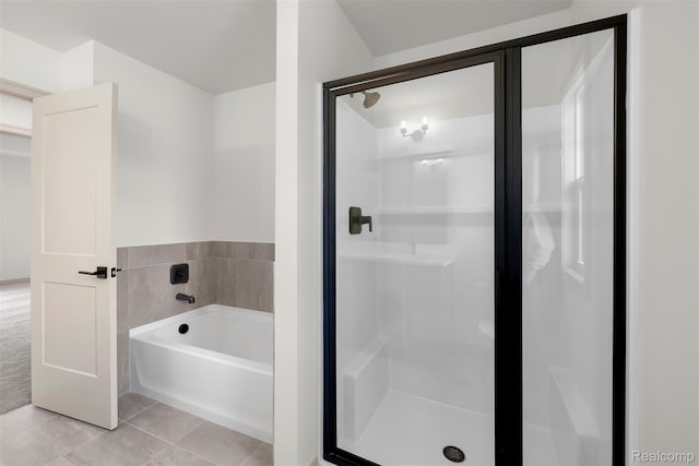 3097 Gecko Trl, Pinckney, MI 48169 - full bathroom featuring tile patterned floors, a bath, and a stall shower