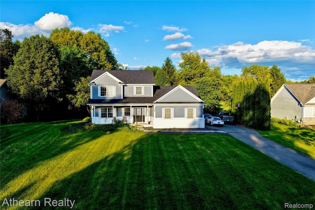 16429 E Horseshoe Trl, Linden, MI 48451 - traditional-style home featuring a front lawn, driveway, and a shingled roof