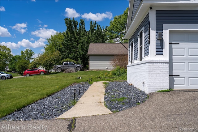 16429 E Horseshoe Trl, Linden, MI 48451 - view of green lawn with a garage