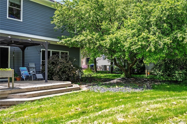 16429 E Horseshoe Trl, Linden, MI 48451 - view of green lawn with a wooden deck