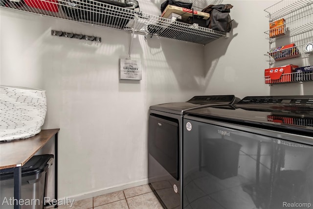 16429 E Horseshoe Trl, Linden, MI 48451 - washroom featuring washer and dryer and light tile patterned flooring