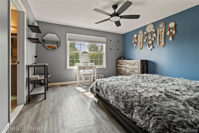 16429 E Horseshoe Trl, Linden, MI 48451 - bedroom with wood finished floors and ceiling fan