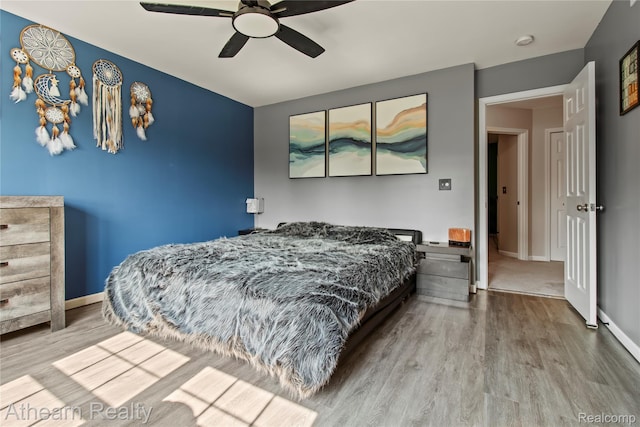16429 E Horseshoe Trl, Linden, MI 48451 - bedroom featuring wood finished floors and ceiling fan