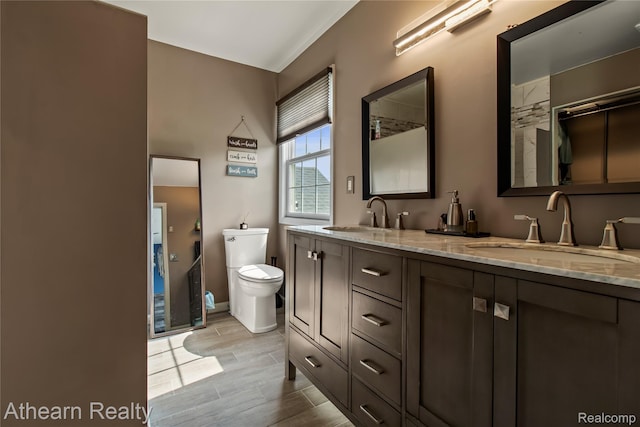 16429 E Horseshoe Trl, Linden, MI 48451 - full bathroom featuring double vanity and wood finish floors