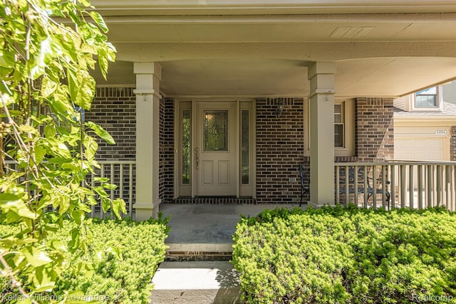 42900 Ledgeview Dr, Novi, MI 48377 - view of exterior entry featuring brick siding and a porch