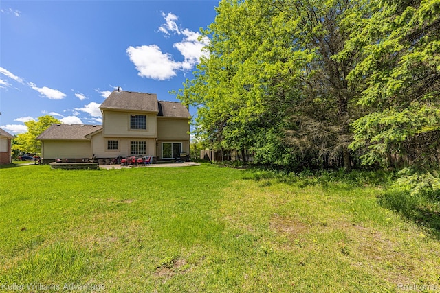 42900 Ledgeview Dr, Novi, MI 48377 - rear view of property with a lawn and a patio area