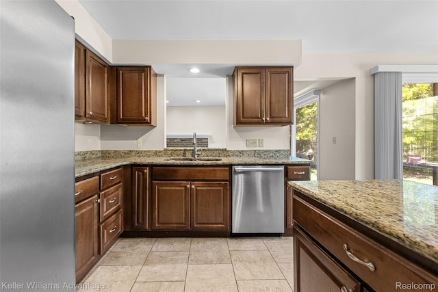 42900 Ledgeview Dr, Novi, MI 48377 - kitchen featuring stainless steel appliances, a sink, plenty of natural light, light stone countertops, and recessed lighting