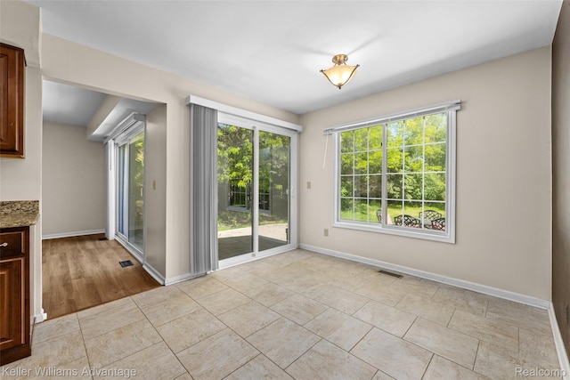 42900 Ledgeview Dr, Novi, MI 48377 - unfurnished dining area featuring baseboards and light tile patterned floors