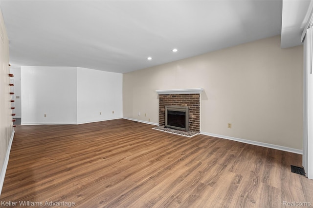 42900 Ledgeview Dr, Novi, MI 48377 - unfurnished living room with wood finished floors, recessed lighting, baseboards, and a fireplace