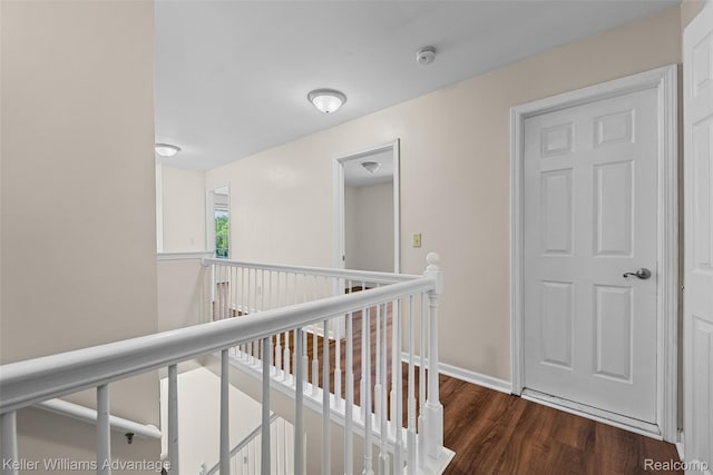 42900 Ledgeview Dr, Novi, MI 48377 - corridor featuring an upstairs landing, wood finished floors, and baseboards