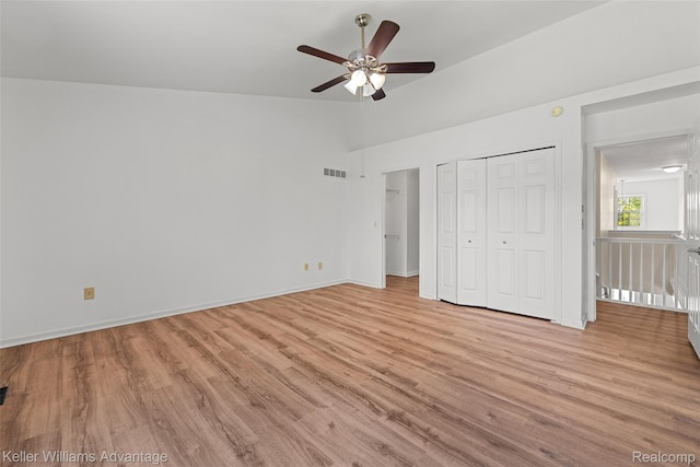 42900 Ledgeview Dr, Novi, MI 48377 - unfurnished bedroom featuring light wood-style flooring, baseboards, a closet, ceiling fan, and lofted ceiling
