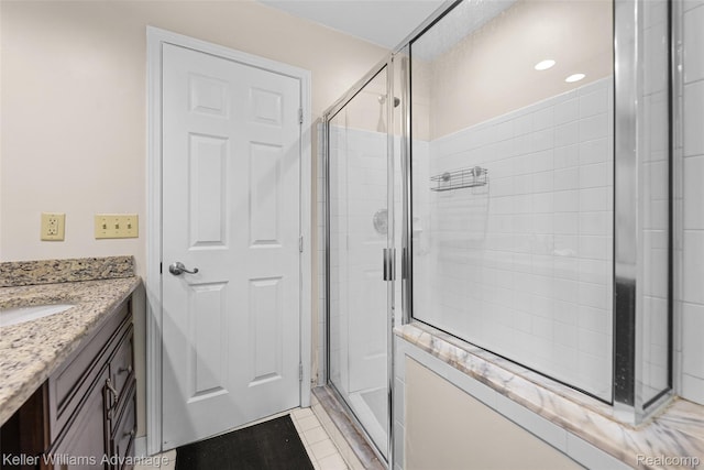 42900 Ledgeview Dr, Novi, MI 48377 - bathroom featuring a shower stall, vanity, recessed lighting, and tile patterned flooring