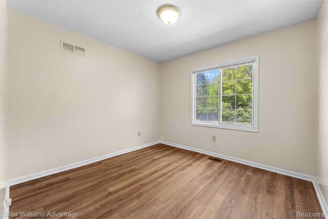 42900 Ledgeview Dr, Novi, MI 48377 - spare room with baseboards and wood finished floors