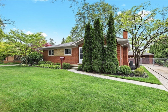 30139 Bentley St, Livonia, MI 48154 - single story home with a chimney, brick siding, and a gate
