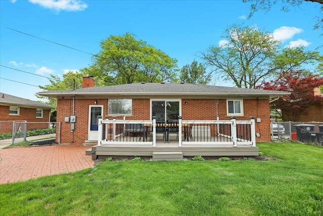 30139 Bentley St, Livonia, MI 48154 - back of house with a chimney, a deck, and brick siding