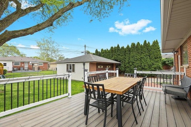 30139 Bentley St, Livonia, MI 48154 - deck with outdoor dining space, a yard, and an outbuilding