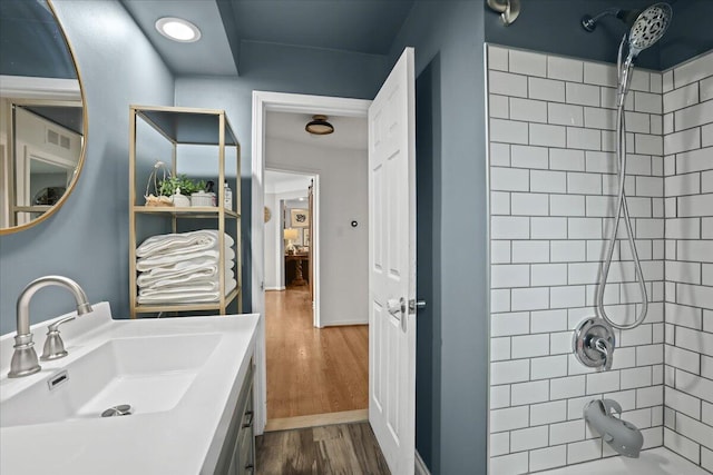 30139 Bentley St, Livonia, MI 48154 - bathroom featuring  shower combination, wood finished floors, and vanity