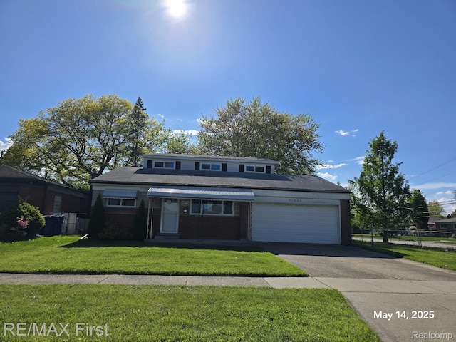 31859 Shawn Dr, Warren, MI 48088 - mid-century modern home featuring a garage, concrete driveway, and brick siding