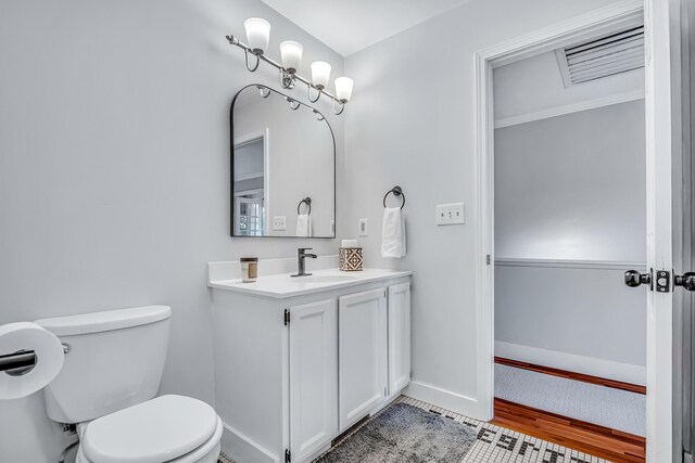 9180 Dicey St, Montague, MI 49437 - bathroom with toilet, vanity, and baseboards