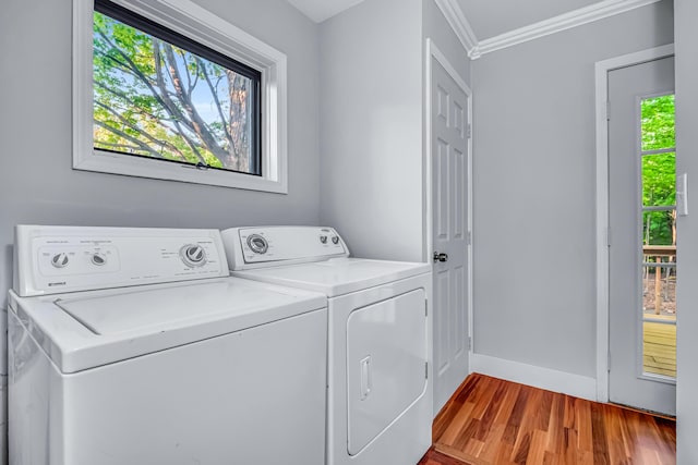 9180 Dicey St, Montague, MI 49437 - laundry room featuring washer and dryer, ornamental molding, wood finished floors, and baseboards